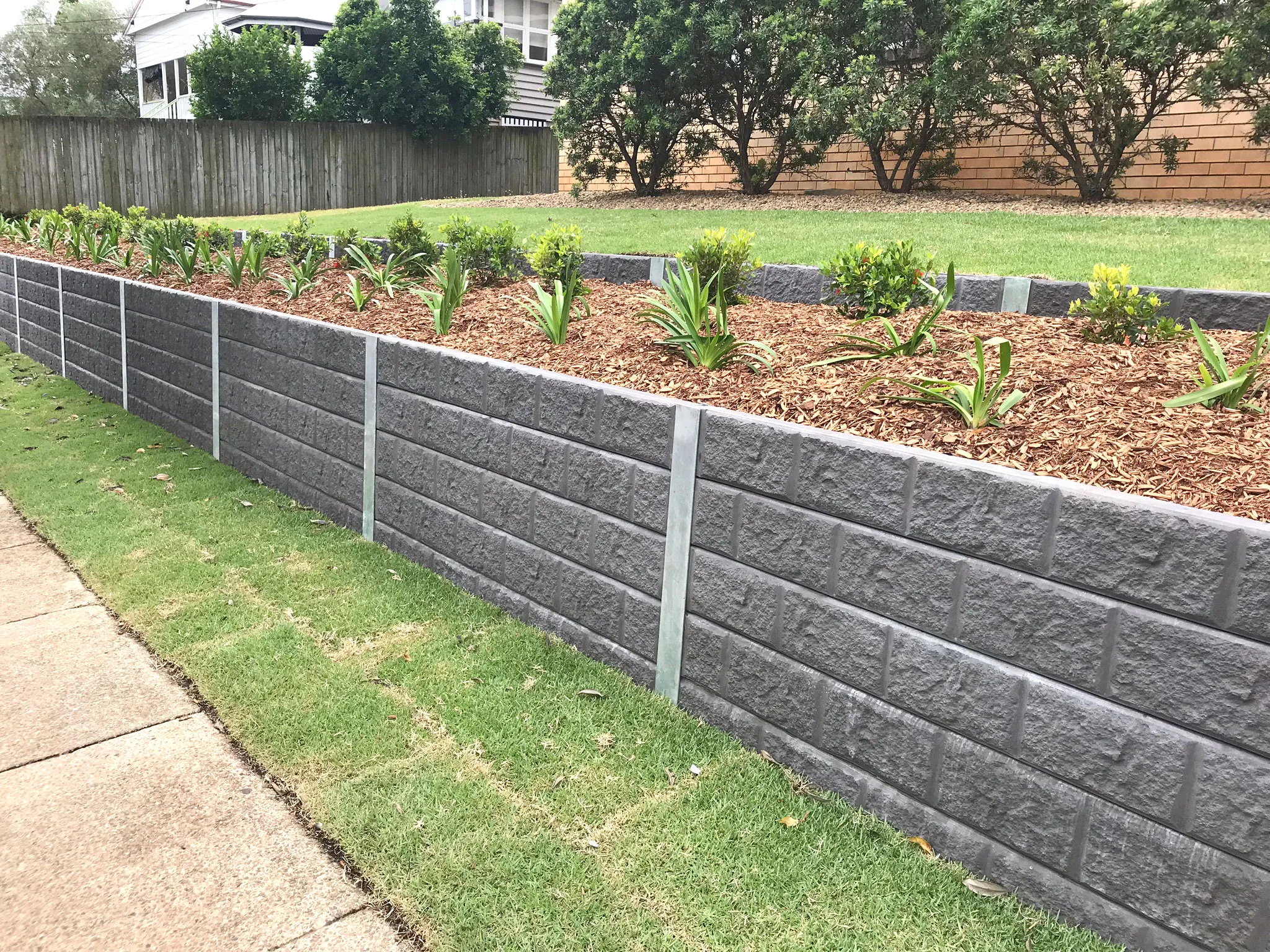 Precast concrete retaining wall under construction