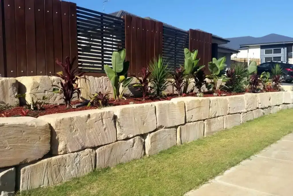 Sandstone retaining wall with garden landscaping on the Mornington Peninsula