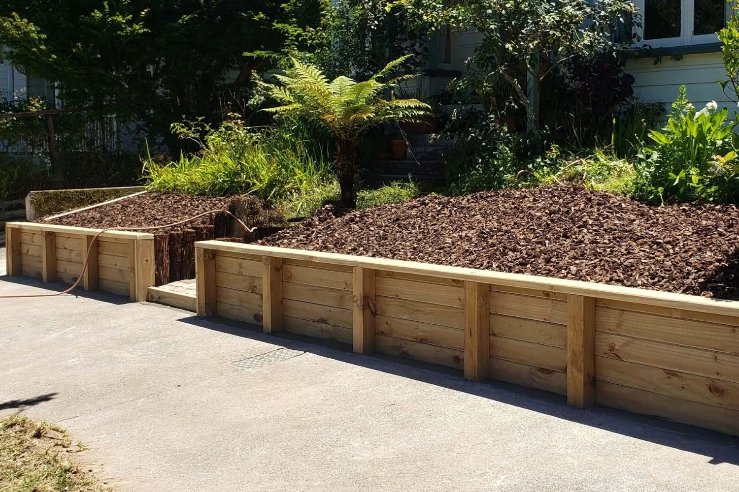 Timber retaining wall on a sloped residential block